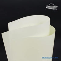Tomoe River FP Loose Sheets A5 Cream - fanned sheets on dark background
